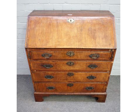 A mid-18th century featherbanded figured walnut bureau, the fitted interior over four long graduated drawers on bracket feet,