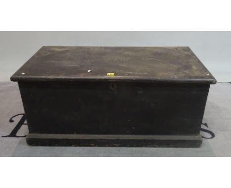 An early 20th century black painted pine trunk, 95cm wide x 44cm high. 