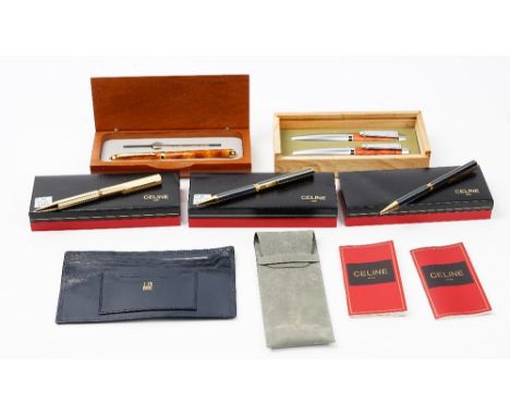 Three Celine, Paris, ballpoint pens, each boxed, a Laguiole fountain and ballpoint pen set, boxed, a brown lacquered ballpoin