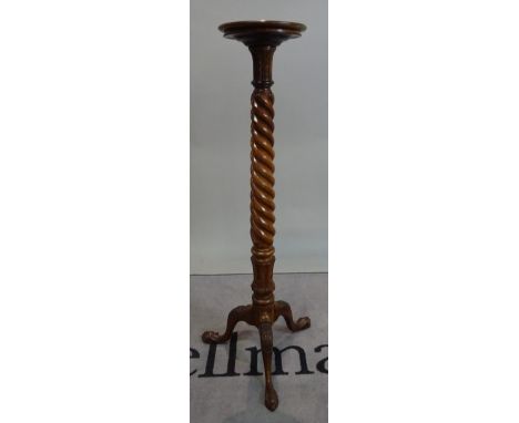 A mahogany jardiniere stand with a spiral column and tripod base, 126cm high.