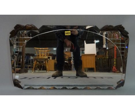 A mid-20th century Art Deco style wall mirror, 69cm wide x 39cm high. 