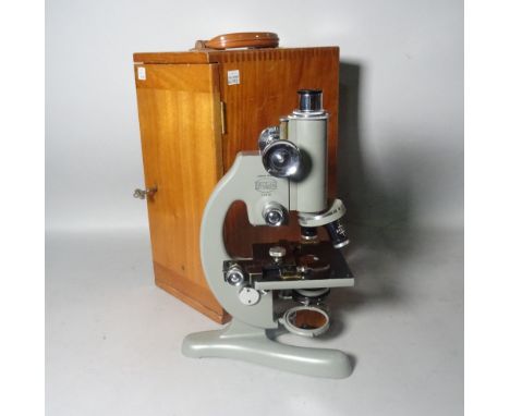 A Beck London Model 47 microscope, in the original fitted case.