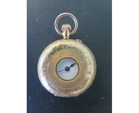 A 14 ct gold top wind half Hunter Ladies pocket watch - Diameter 3 cm - with base metal back plate
Condition report: Some den