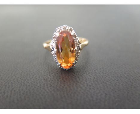 An 18ct gold citrine and diamond cluster ring - Hallmarked Birmingham - Ring size S - Weight approx 5.7gms
Condition Report: 