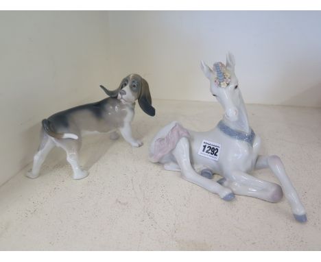 A Lladro Unicorn and a Lladro Dog 
Condition report: Both in good condition 