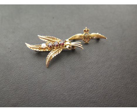 Two 9ct gold brooches RAF brooch - With enamel detail - Width 3.3cms - Together with a garnet and seed pearl sheaf brooch - W