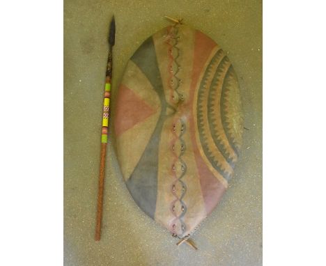 An early 20th century Maasai hide shield with painted decoration wooden rib and handle - 1.15 m x 56 cm with a cut down Hunti