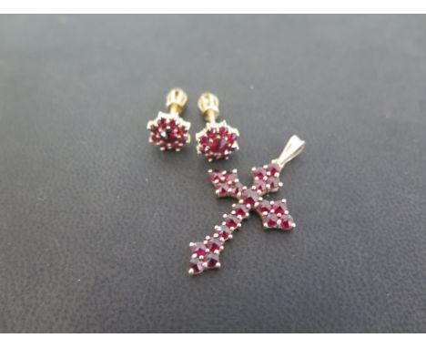 A garnet cross pendant - Stamped 585 (14ct) - Length 3.7cms - Weight approx 2.9gms - Together with a pair of Bohemian garnet 