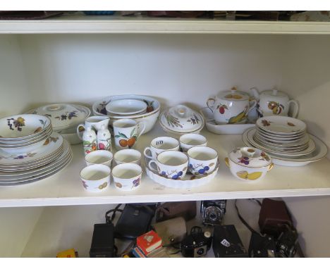 A Royal Worcester Evesham pattern dinner service and oven ware - an oblong and square casserole, fluted flan dish, oblong cas