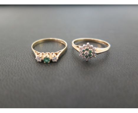 Two 9ct gold emerald and diamond rings - To include a cluster and a three-stone - Hallmarked London and Birmingham - Ring siz