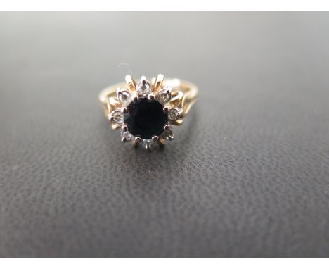 An 18ct gold sapphire and diamond floral cluster ring - Hallmarked Birmingham - Ring size M 1/2 - Weight approx 4.4gms
Condit