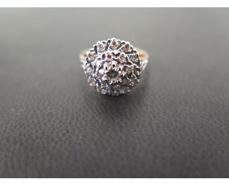 A diamond cluster ring - Tests as higher carat gold - Ring size M - Weight approx 4.4gms
Condition Report: Good to fair - Wit