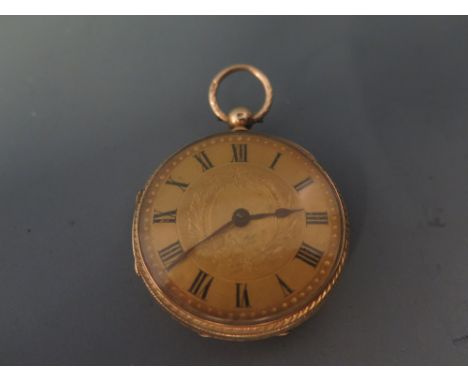 A Victorian 18ct gold open face pocket watch - having engine turned dial with Arabic numerals and poire hands with elaborate 