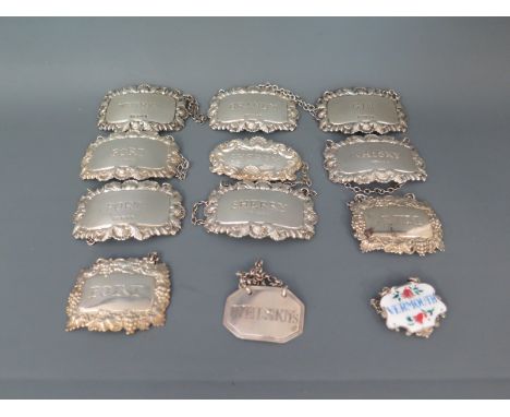 Twelve silver decanter labels approx total silver weight 4.5 troy oz
