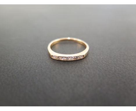 An 18ct gold diamond band ring - Hallmarked London - Ring size K - Weight approx 1.5gms
Condition Report: Good - With light s