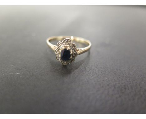 A sapphire and diamond cluster ring - Tests as 9ct gold - Ring size S - Weight approx 2.1gms
Condition Report: Good to fair -