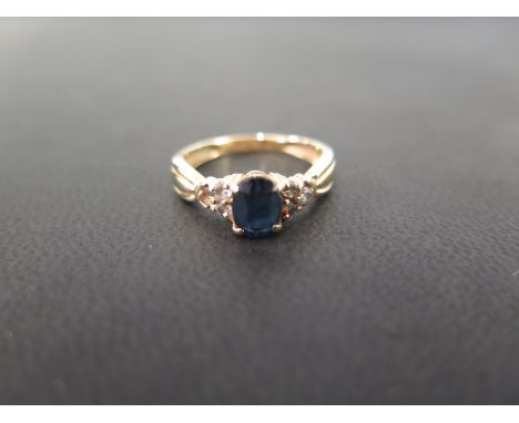 A sapphire and diamond dress ring - Tests as higher carat gold - Ring size N - Weight approx 3.2gms
Condition Report: Fair - 