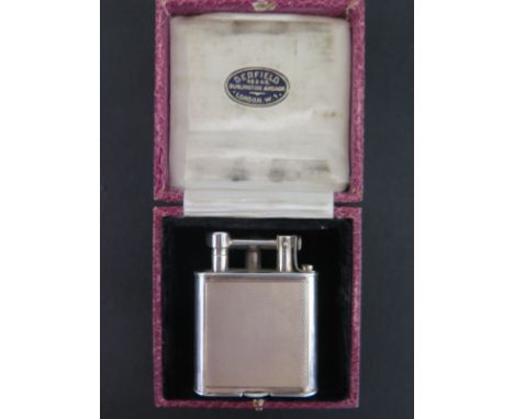 A Dunhill silver Gents pocket lighter with engine turned finish 