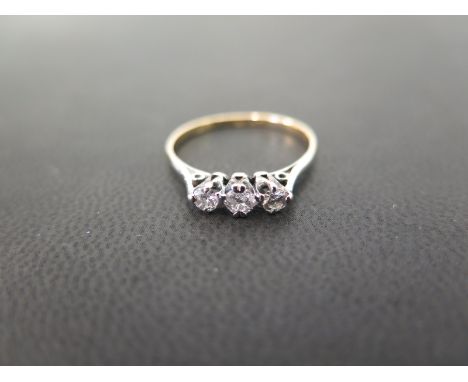 A brilliant-cut diamond three-stone ring - Estimated total diamond weight 0.30ct - Stamped 18ct & plat - Ring size P - Weight