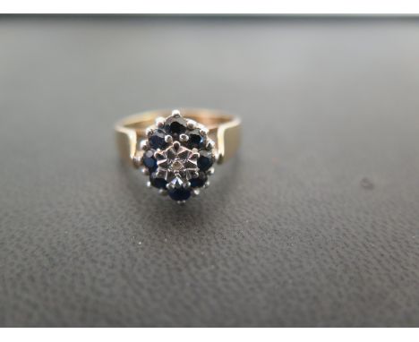 A 9ct gold sapphire and diamond cluster ring - Hallmarked London - Ring size P - Weight approx 4.3gms
Condition Report: Good