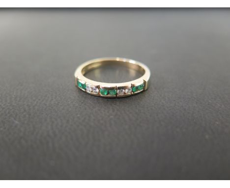 A 9ct gold emerald and diamond half-circle ring - Hallmarked Birmingham - Ring size R - Weight approx 2.3gms
Condition Report