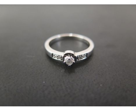 A 9ct gold diamond ring - The brilliant-cut diamond to the similarly-cut diamond shoulders - Hallmarked Birmingham - Ring siz