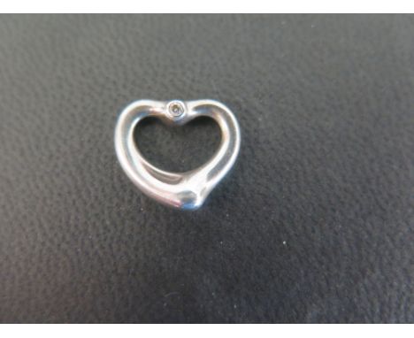 TIFFANY & CO - an open heart pendant with diamond highlights - Signed Elsa Peretti - Stamped 925 Spain - Length 1.5cms - Weig