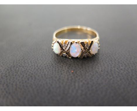 An opal and diamond dress ring - Stamped 18ct - Ring size Q - Weight approx 4.6gms
Condition Report: Good - With light surfac