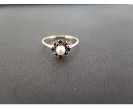 A 9ct gold cultured pearl and sapphire cluster ring - Hallmarked Birmingham - Ring size M - Weight approx 1.1gms
Condition Re