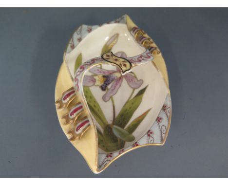 An Arts and Crafts ceramic dish decorated with foliate design