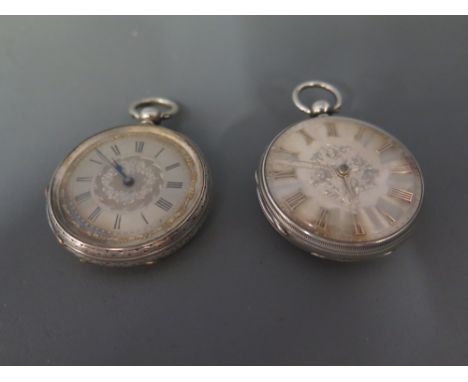Two Victorian silver engine turned open face pocket watches, both with key wind movements - Dial diameter 40 mm
Condition rep