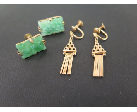 A pair of carved jade panel earrings - Tests as higher carat gold - Length 1.8cms - Together with a pair of fringe ear pendan