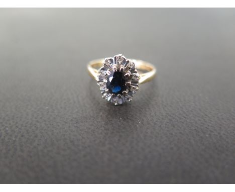 An 18ct gold sapphire and diamond cluster ring - Hallmarked London - Ring size O 1/2 - Weight approx 3.7gms
Condition Report: