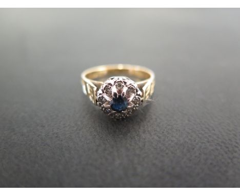 An 18ct gold sapphire and diamond cluster ring - Hallmarked Birmingham - Ring size J - Weight approx 3.7gms
Condition Report: