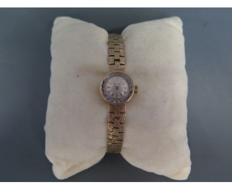 A 1970's Bueche-Girod ladies 9ct gold cocktail watch with metallic dial having applied gilt stick markers and pencil hands, h