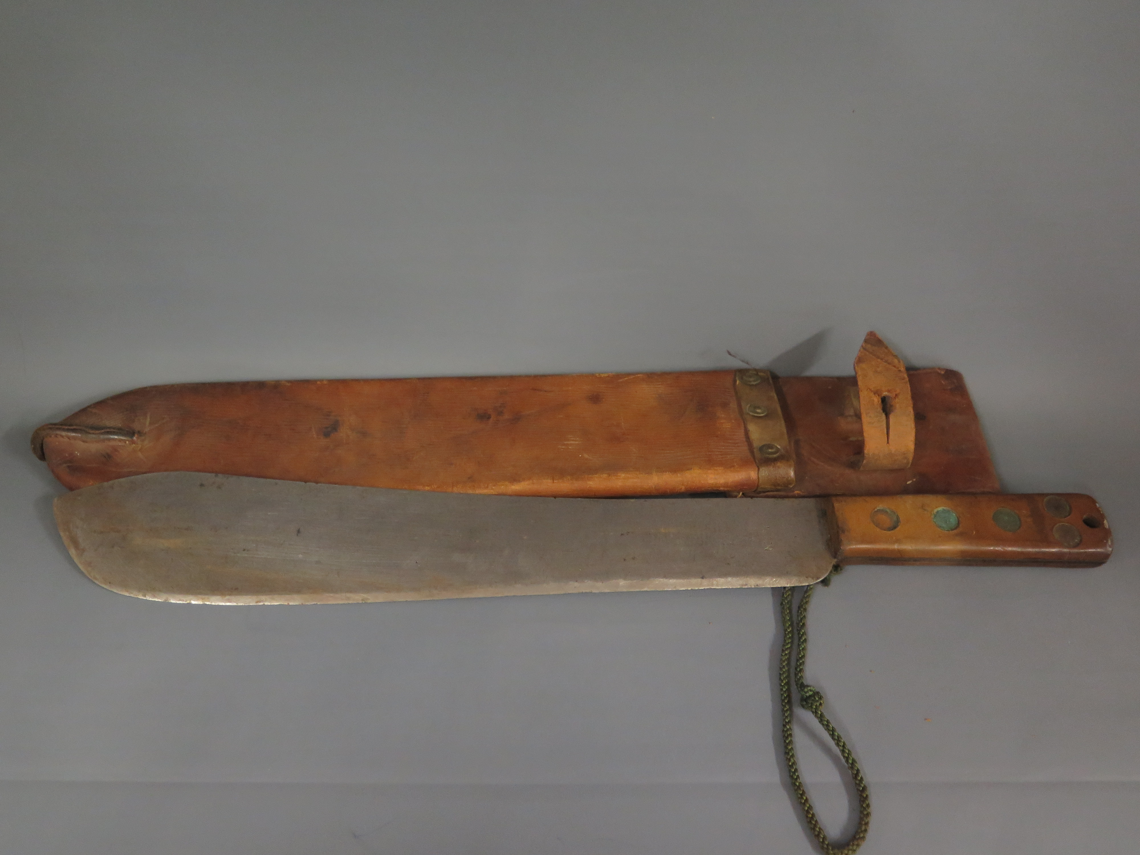 A World War II British Army issue machete and scabbard - Length 53 cm