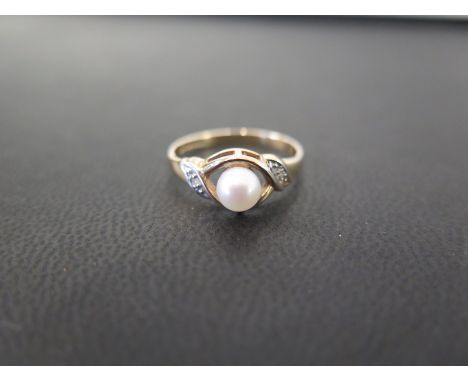 A 9ct gold cultured pearl and diamond dress ring - Hallmarked London - Ring size L - Weight approx 1.7gms
Condition Report: G