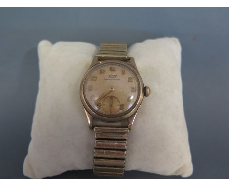 A Tissot 9ct gold gentleman's wristwatch, Dennison cased with cream dial and applied gilt indices and minute track, gilt narr