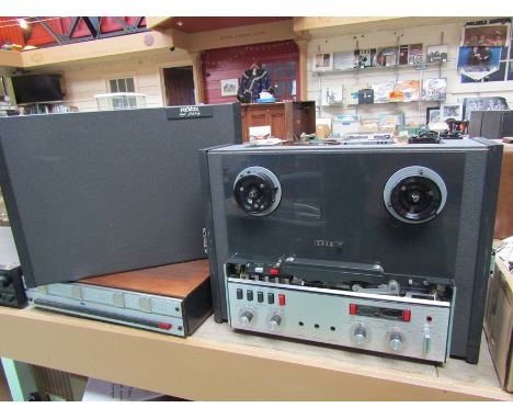 A Revox A77 reel to reel tape recorder with assorted reels, leads and manual 