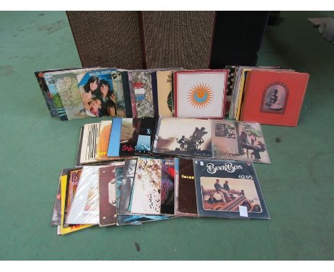 A box of mixed LP's including King Crimson 'Lark's Tongues In Aspic' (repress), The Beatles, Sunshine, The Stone Roses, Santa