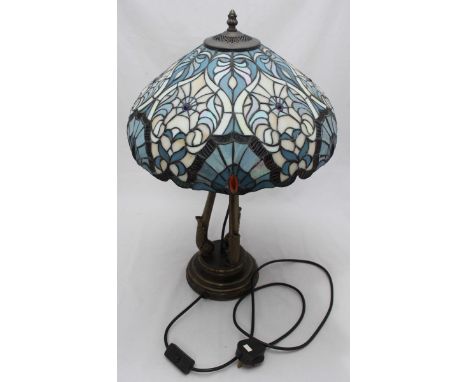 A Tiffany 'style' table lamp with coloured plastic and leaded shade, interspersed with coloured cabochon stones, raised on a 