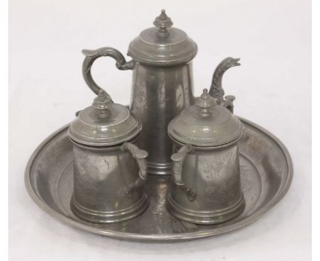 A Huikee Swatow four-piece pewter tea set with engraved dragon decoration, comprising a teapot, sugar bowl, cream jug and tra