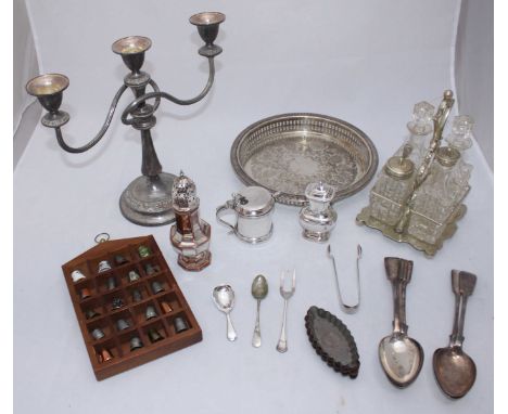 A white metal three-light candelabra, together with eight vintage French Gaufrex tart tins, silver-plated items including a s