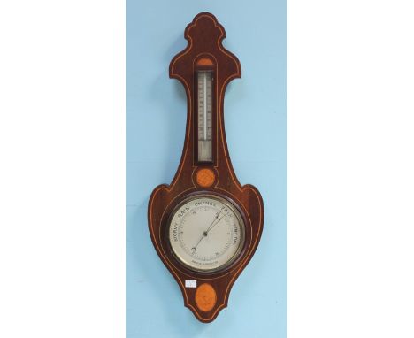 An Edwardian inlaid mahogany aneroid barometer, the two silvered dials with barometer and thermometer windows, 87cm long.
