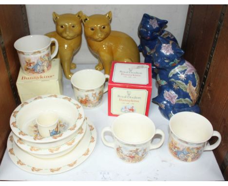 SECTION 26.  Two pairs of ceramic cats, one pair with floral decoration to a blue ground, the other in yellow, together with 