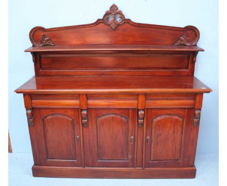 A reproduction Victorian style mahogany chiffonier sideboard, the raised back with shelf, leading to three short, concave fri