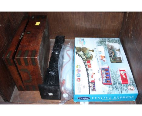 SECTION 40.  A wooden & brass bound box, together with a ceramic rolling pin, carved totem pole and a Festive train set