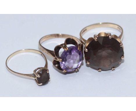 A 9ct gold ring set with a large smoky quartz measuring  approx. 1.7cm across, size O/P, together with a 9ct gold ring set wi