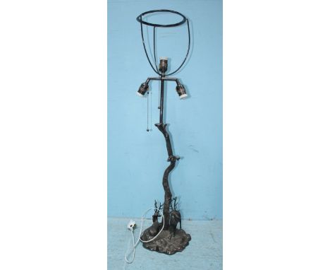 A silver-plated lamp modelled as a tree trunk, with two deer, raised on a naturalistic base. 102cm high including lamp shade 