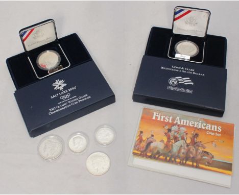 A 2002 Olympic Winter Games Commemorative Proof Struck Silver Dollar and a 2004 Proof Struck Lewis and Clark Bicentennial Sil